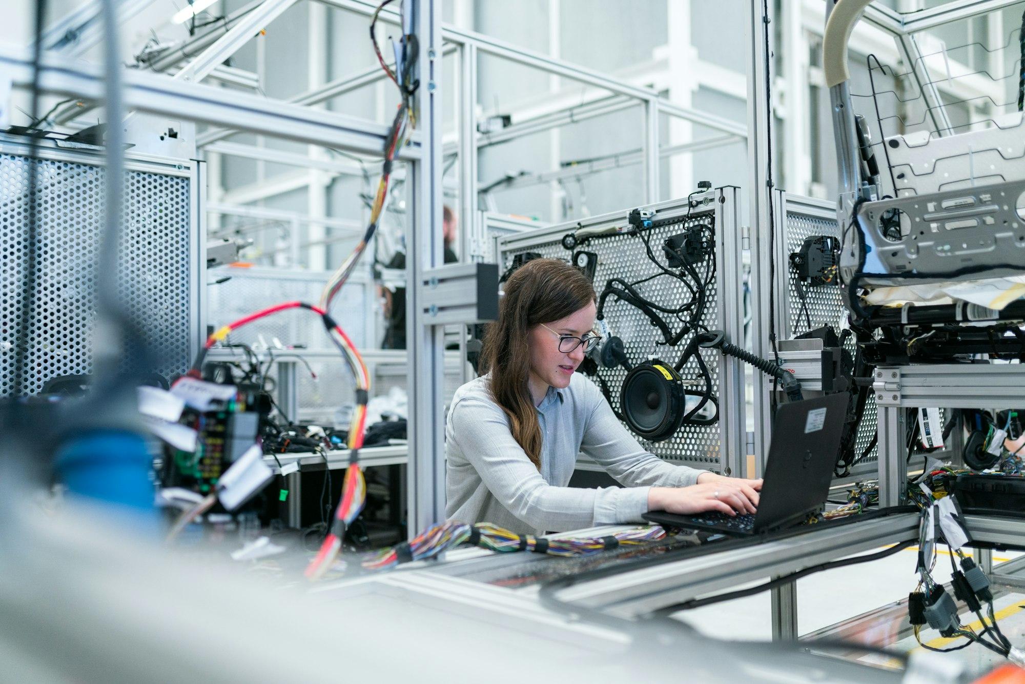 Engineer inspecting components with precision instruments